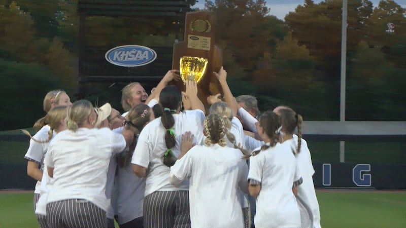 The Lady Spartans hoist their first state softball trophy