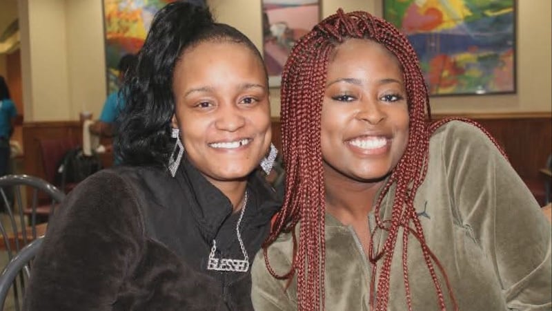 Kayeeka Dawson (left) and her younger sister Reachel (right) pose for a photo.