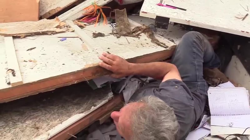 A man was trapped underneath debris following several tornadoes that barreled through some...